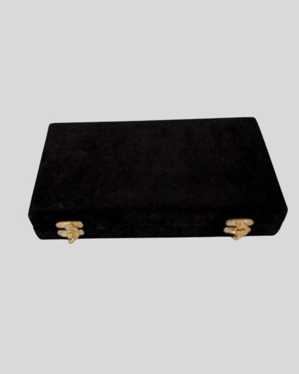 Black velvet case with gold clasps for wrestling side plates
